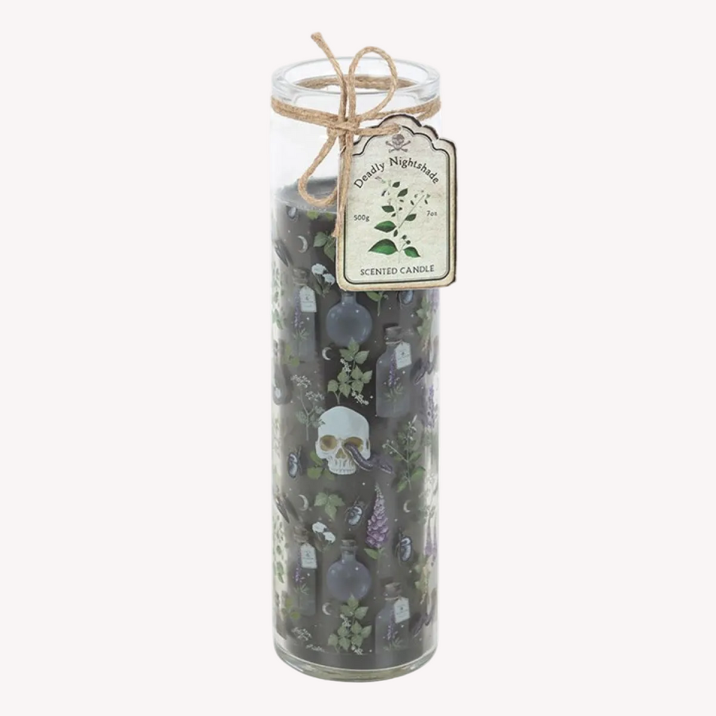 Decorative candle with skull and potion bottle design in a glass jar on a white background