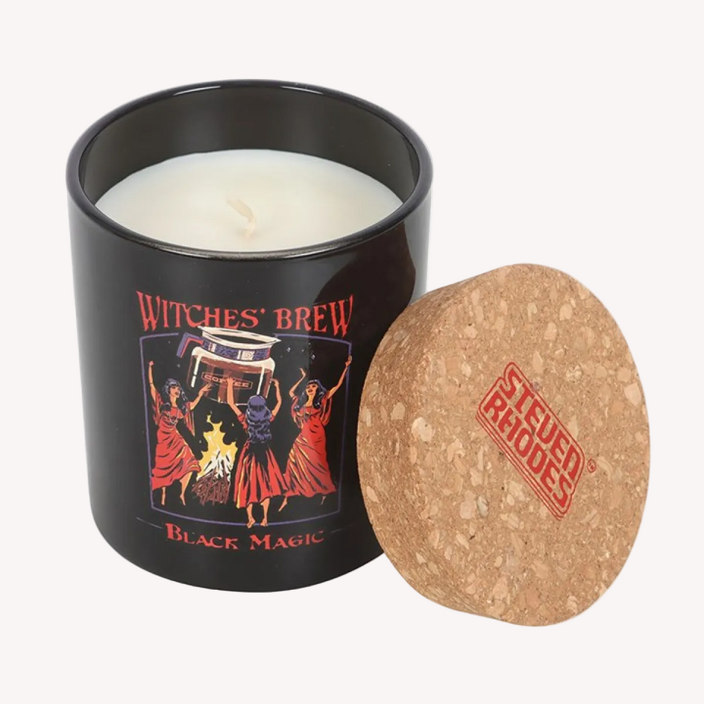 Candle in a black container with 'Witches' Brew' label and cork lid, featuring 'Steven Rhodes' branding.