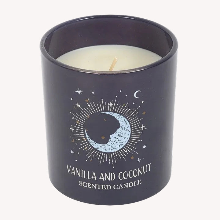 Scented candle with moon and star design on a white background