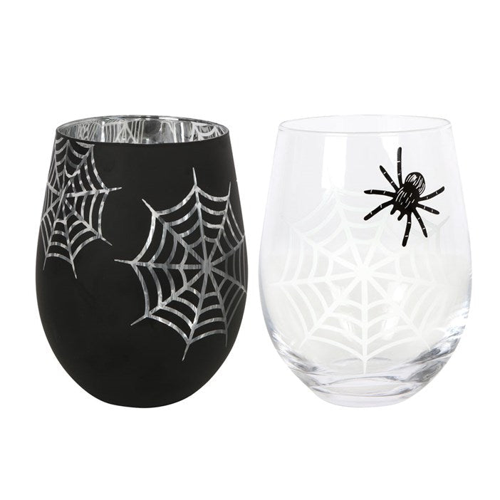 Two Halloween-themed wine glasses with spider and web designs on a white background
