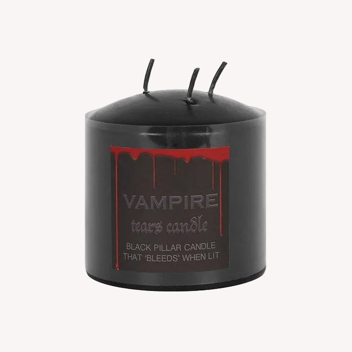 Black pillar candle with 'Vampire Tears' text and red design on a white background