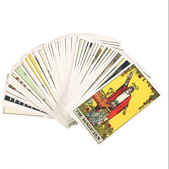 Fanned tarot cards with 'The Magician' card prominently displayed on a white background