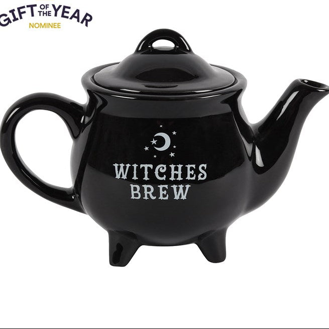 Black teapot with 'Witches Brew' text on a white background