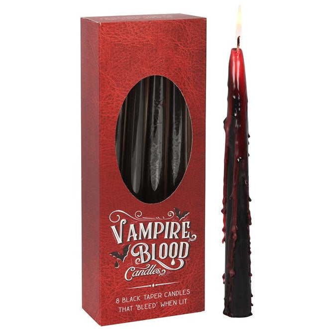 Red box of 'Vampire Blood' candles with a black candle on a white background