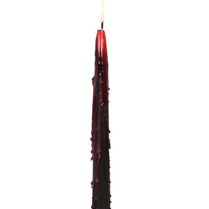 Tall, dark red candle with a white background