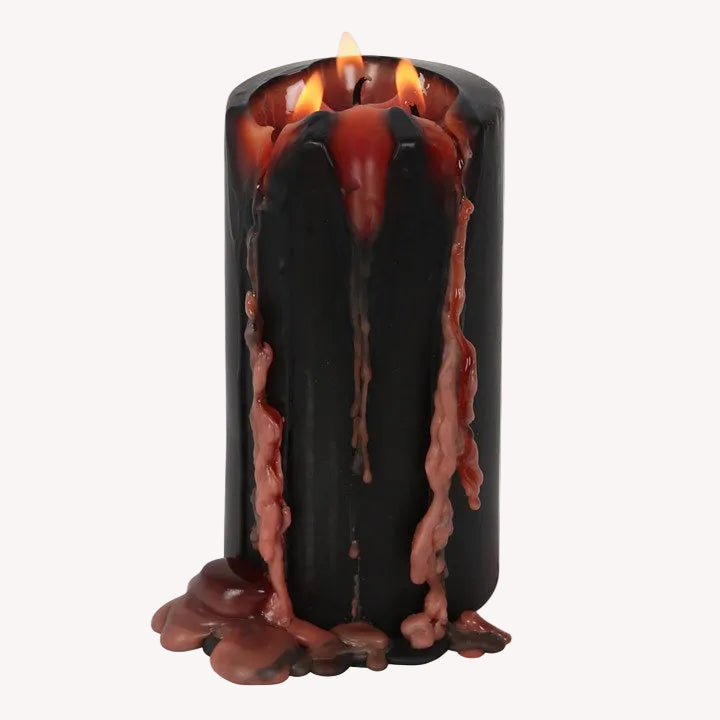 Black candle with molten wax effect and flames on a white background
