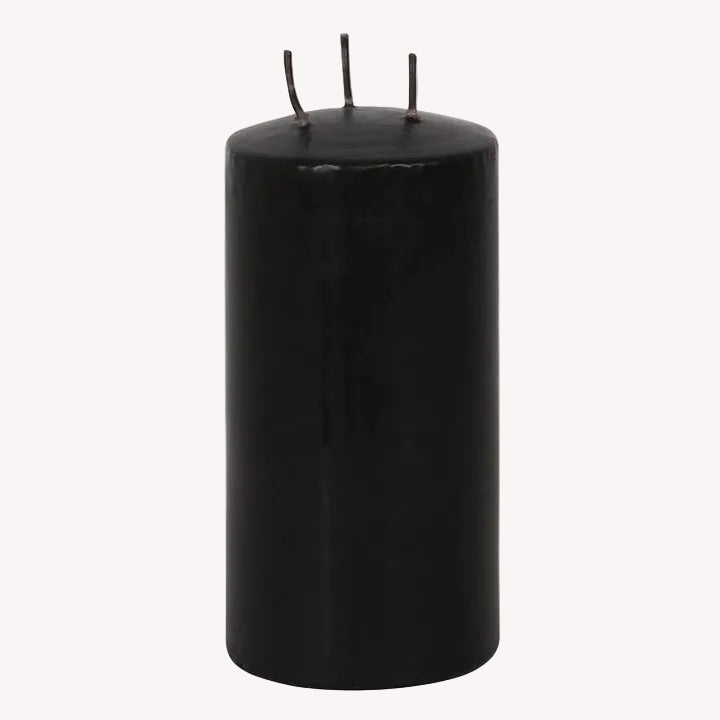 Black candle on a white background