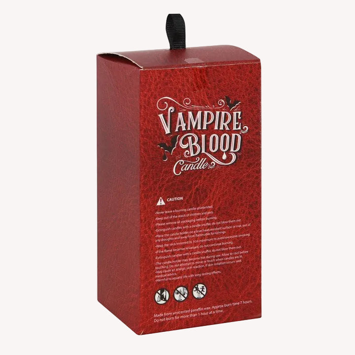 Red box packaging for 'Vampire Blood Candle' with text and icons on a white background