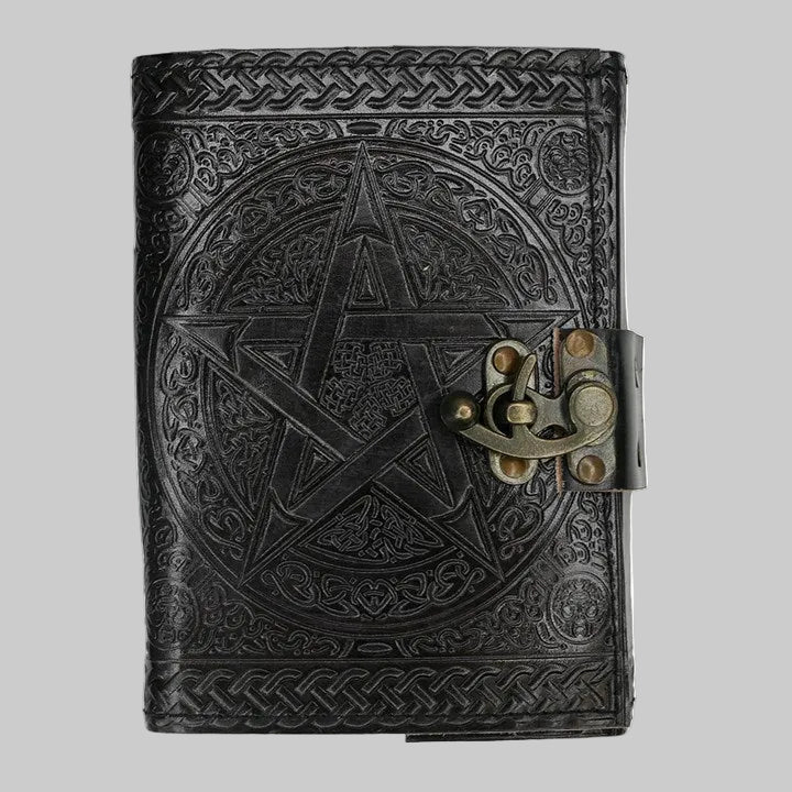 Black leather journal with pentagram design and brass lock on a white background