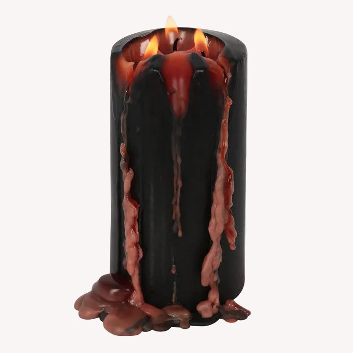Black candle with molten wax effect and flames on a white background