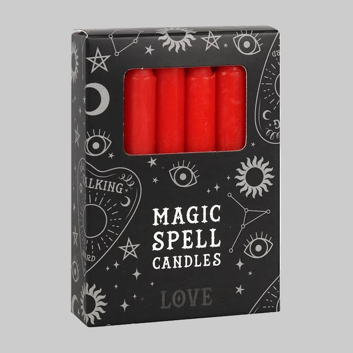Box of red 'Magic Spell Candles' with wiccan symbols on a white background