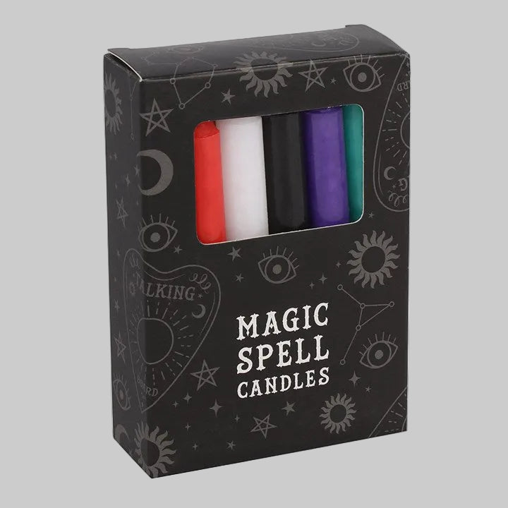 Box of 'Magic Spell Candles' with colorful candles inside on a white background