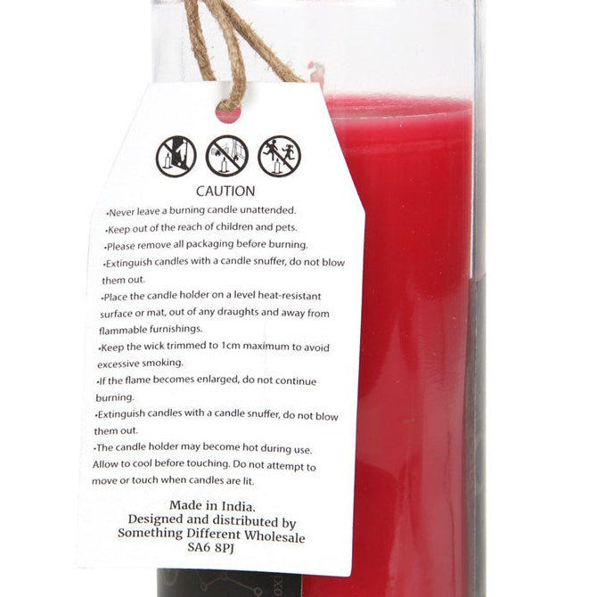 Red candle with a warning label on a white background