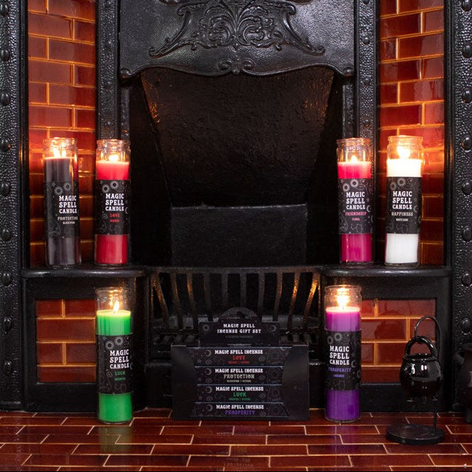Candles with labels in front of a fireplace