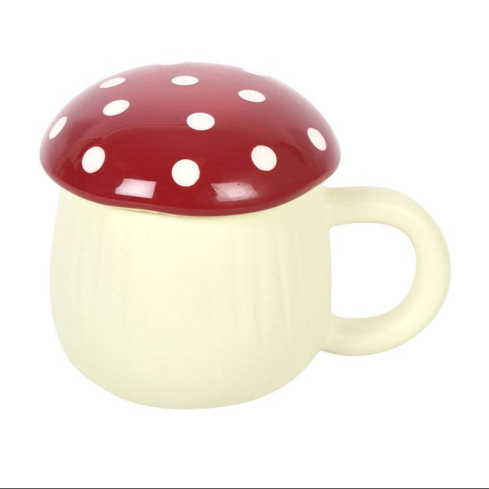 Mushroom-shaped mug with a red cap and white spots on a white background