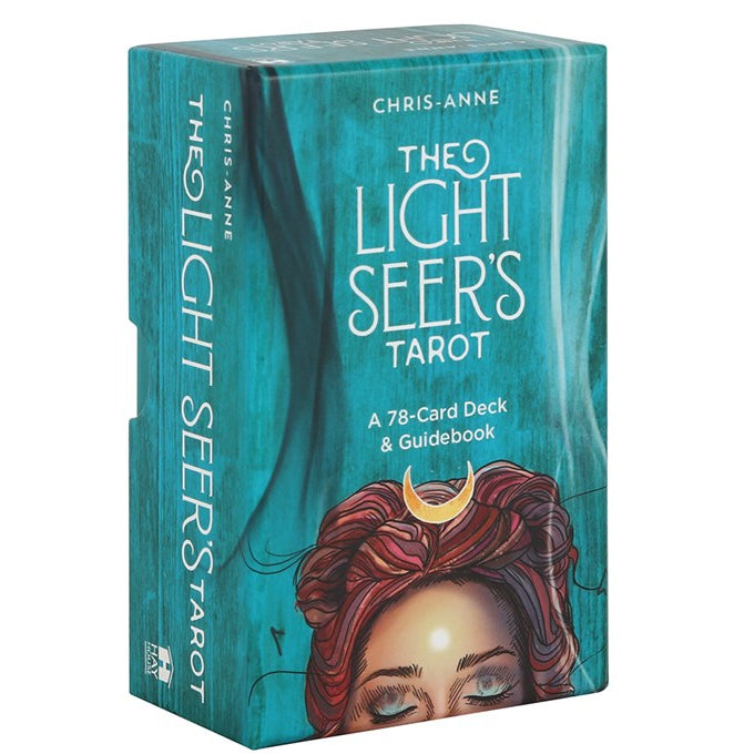 Box of 'The Light Seer's Tarot' with a teal background and illustration of a woman with red hair and a crescent moon.