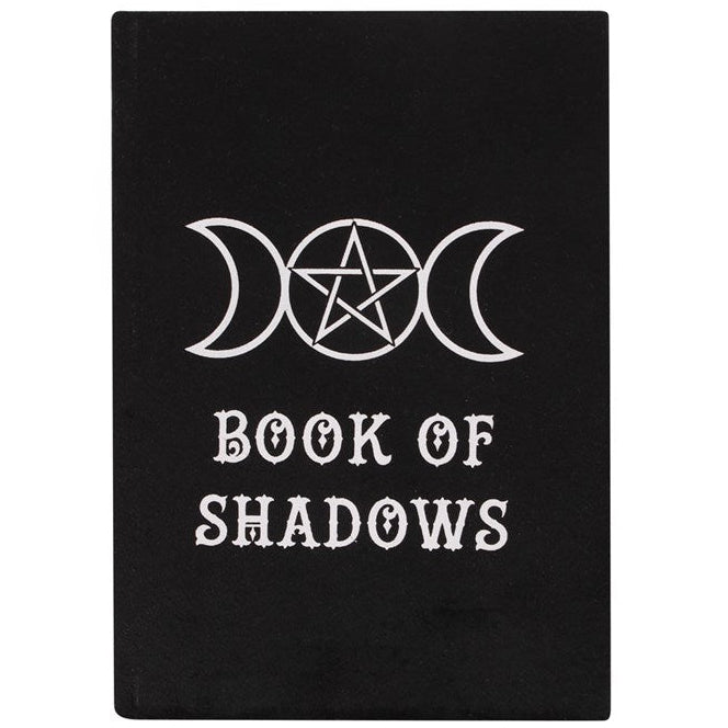 Black book titled 'Book of Shadows' with white symbols on a white background