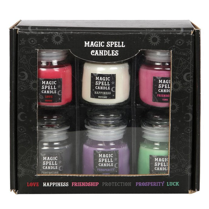 Set of six 'Magic Spell Candles' in a decorative box with labels on a white background.