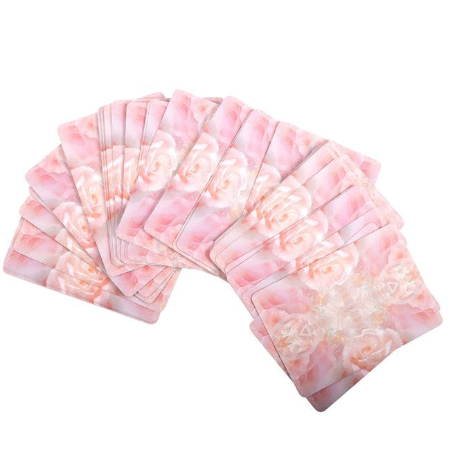 Set of pink floral cards fanned out on a white background