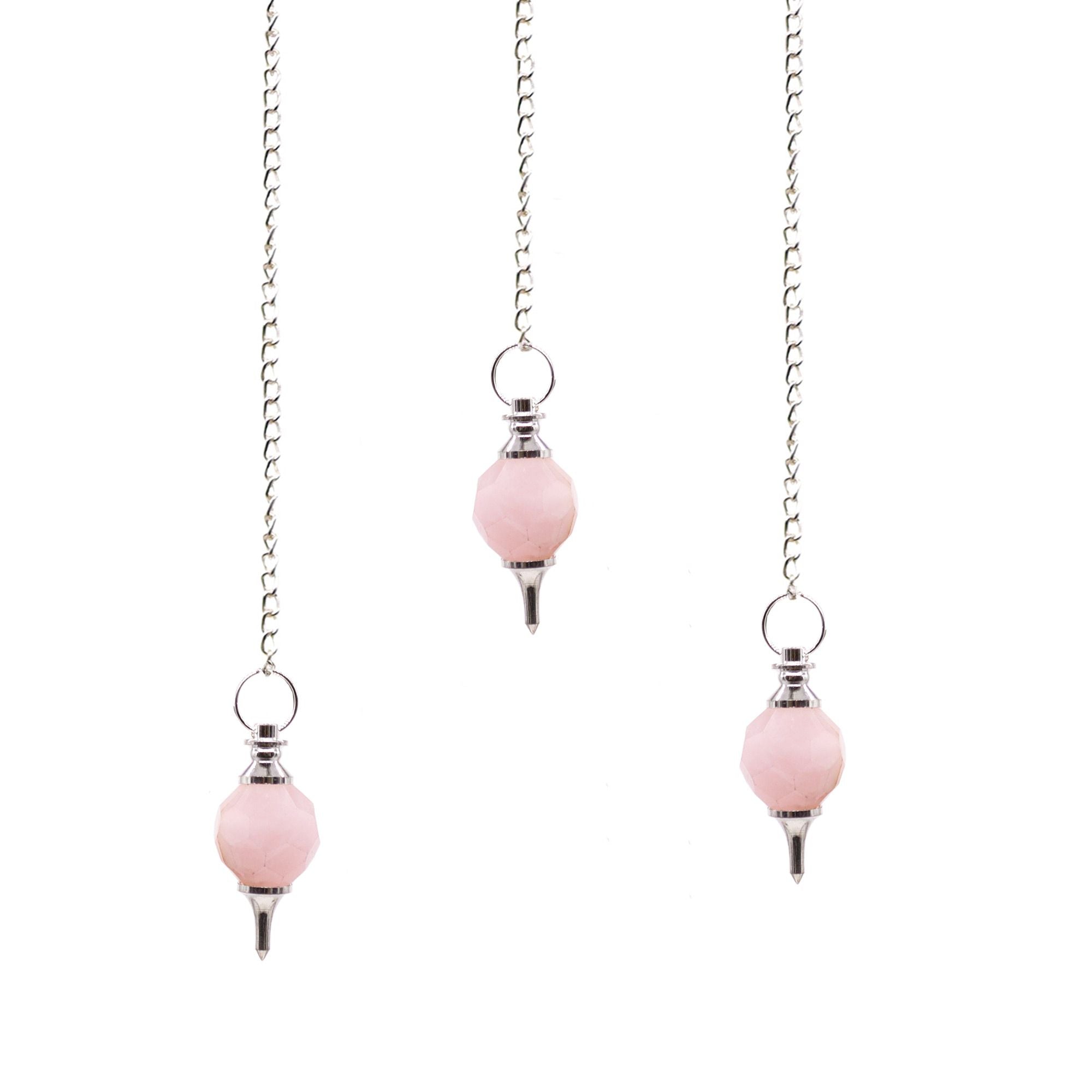 Pair of pink earrings with silver chains on a white background