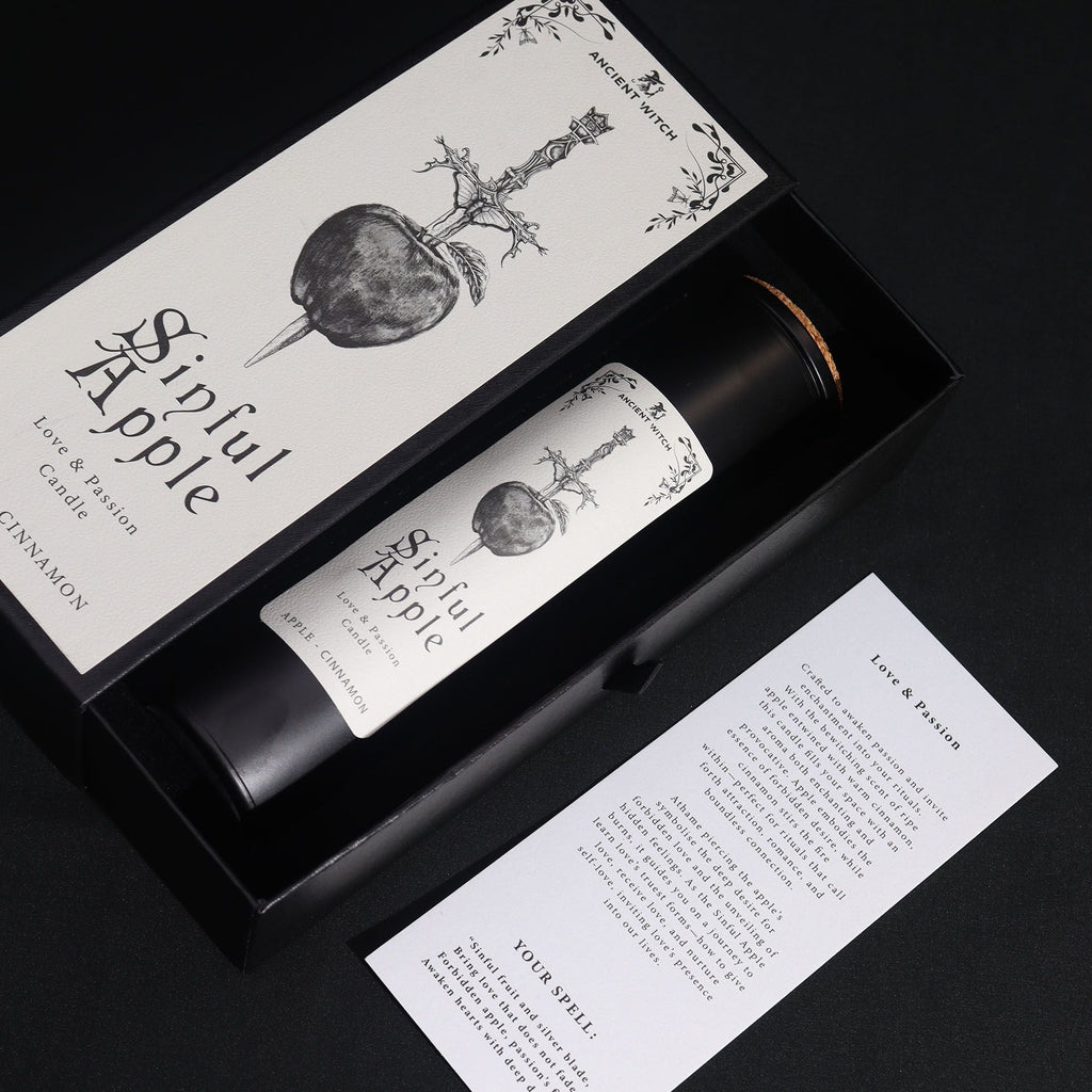 Candle set with packaging and a card on a black background