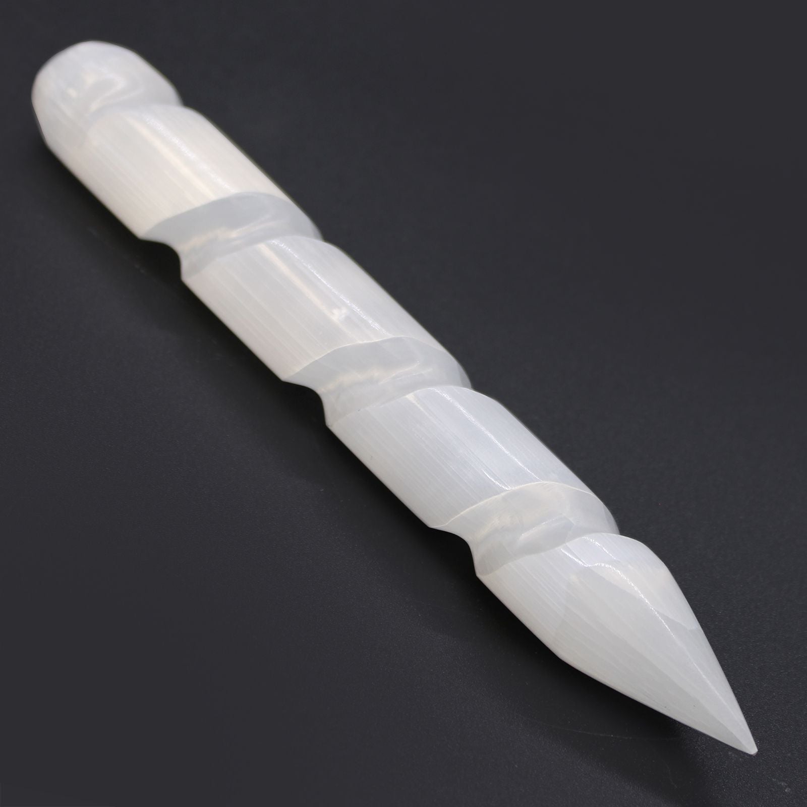 White ceramic tool on a black background