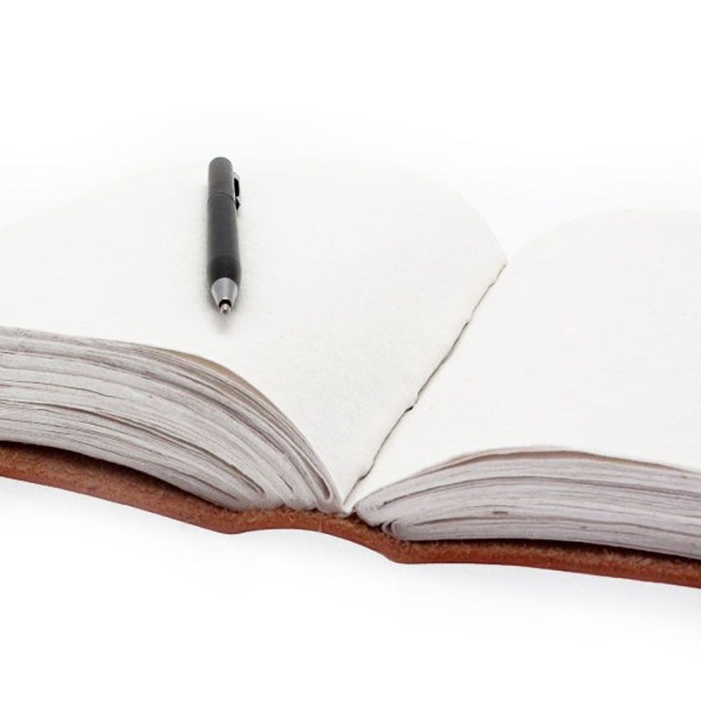 Open notebook with a pen on a white background