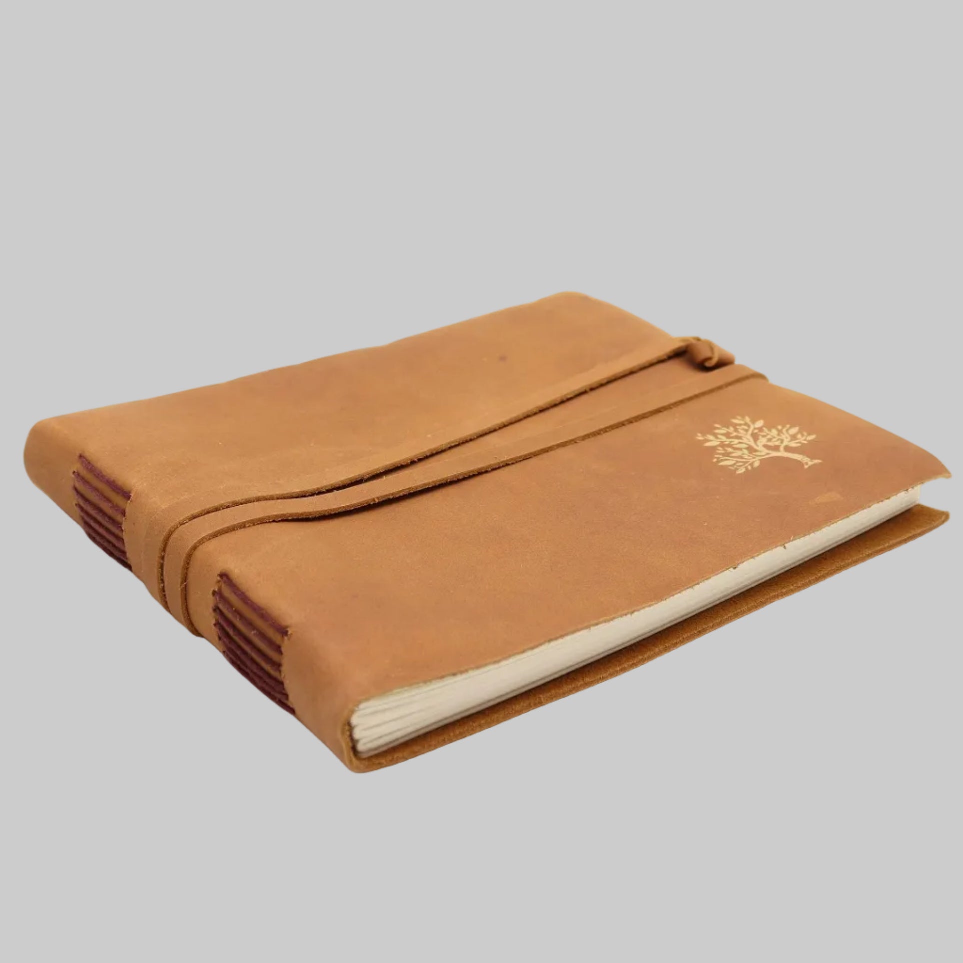 Brown notebook with a tree design on a white background