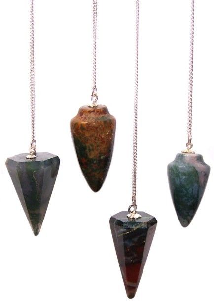Four stone pendulums on chains against a white background