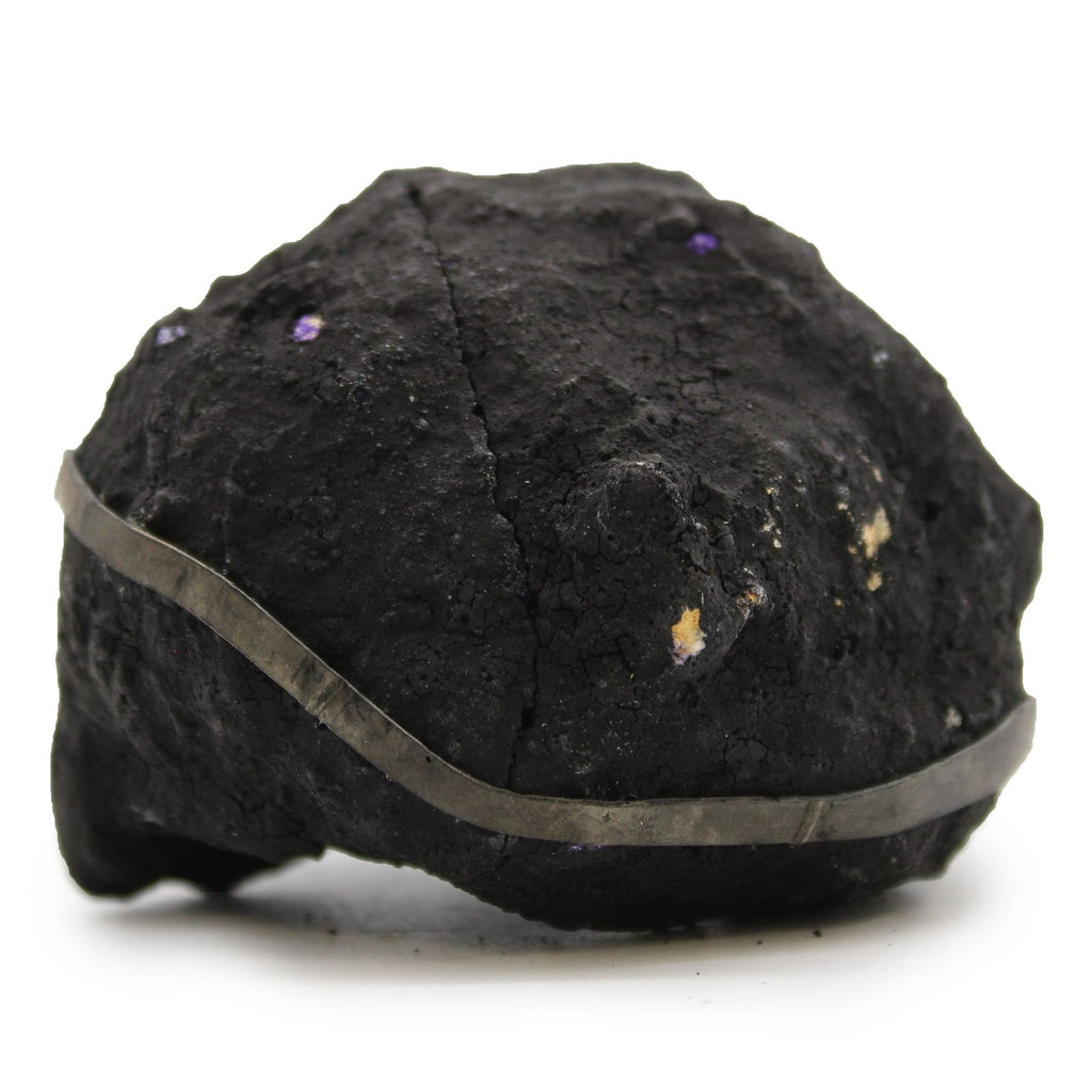 Black rock with a band on a white background