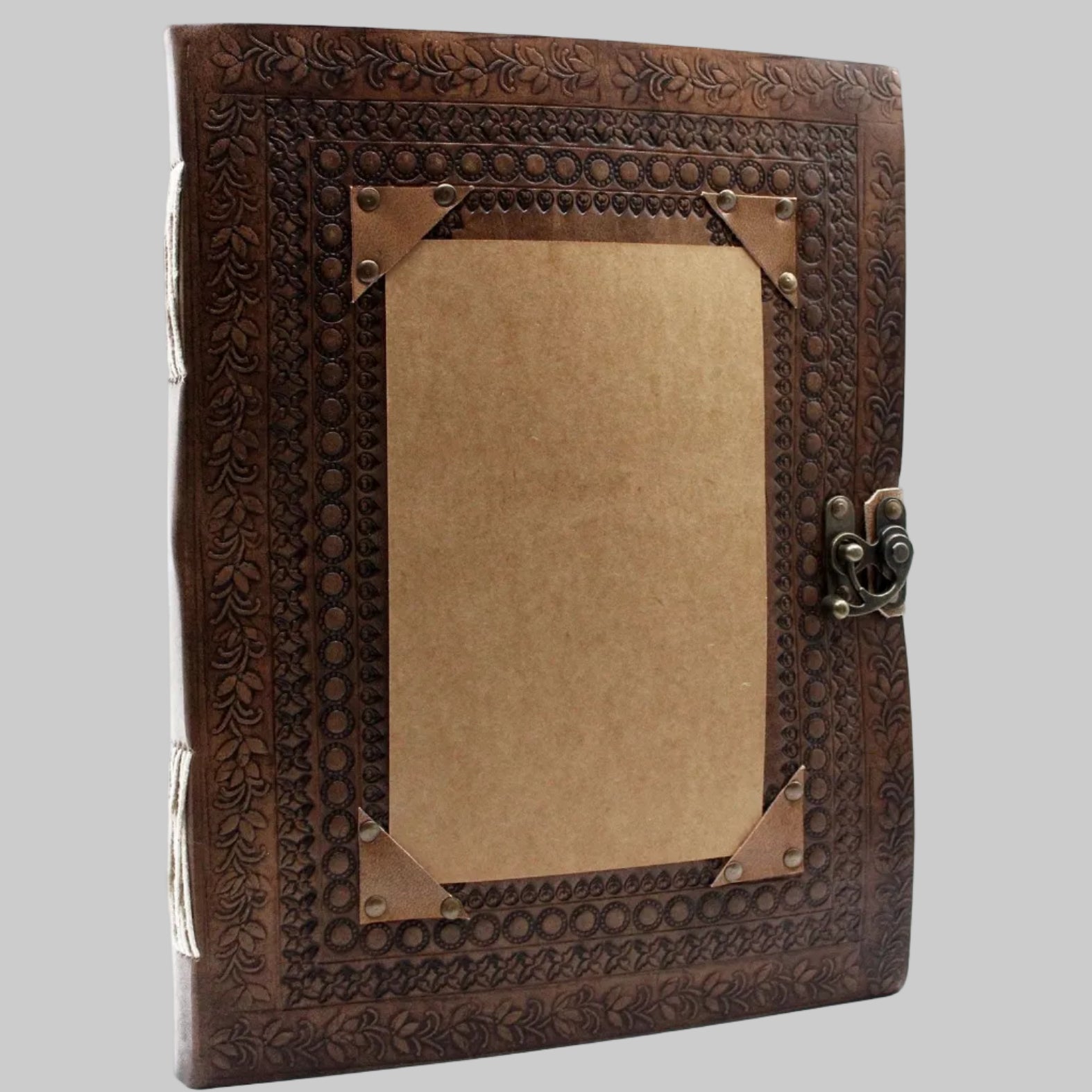 Decorative wooden box with intricate carvings and a metallic clasp on a white background