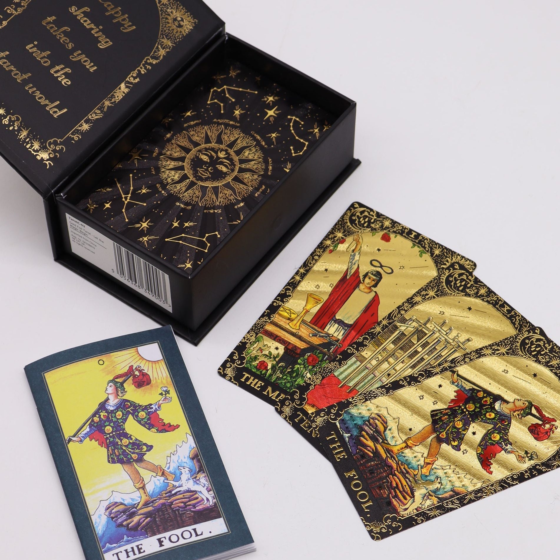 Tarot cards with 'The Fool' card open, showing intricate designs and symbols on a white background.