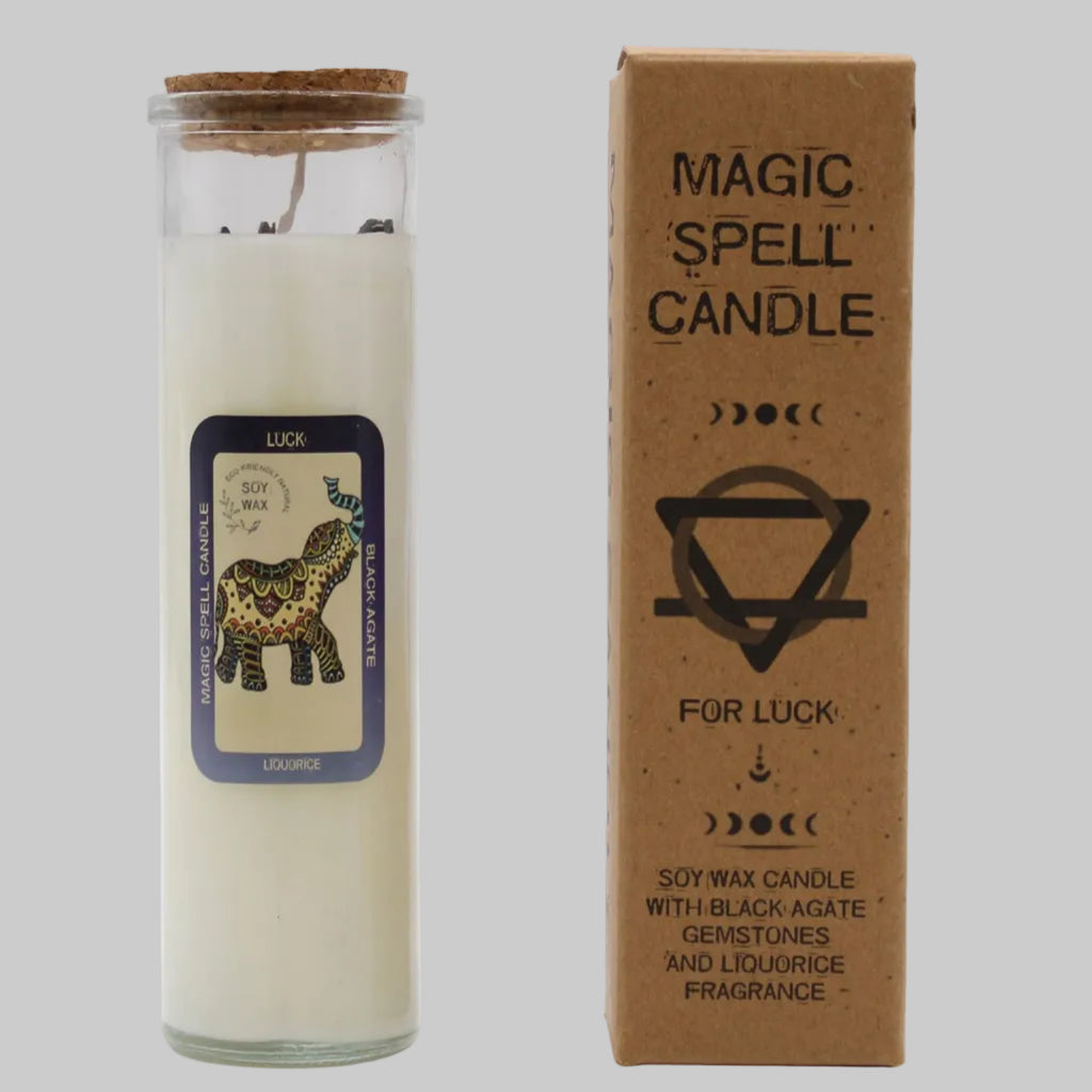 Magic spell candle for luck with packaging on a white background