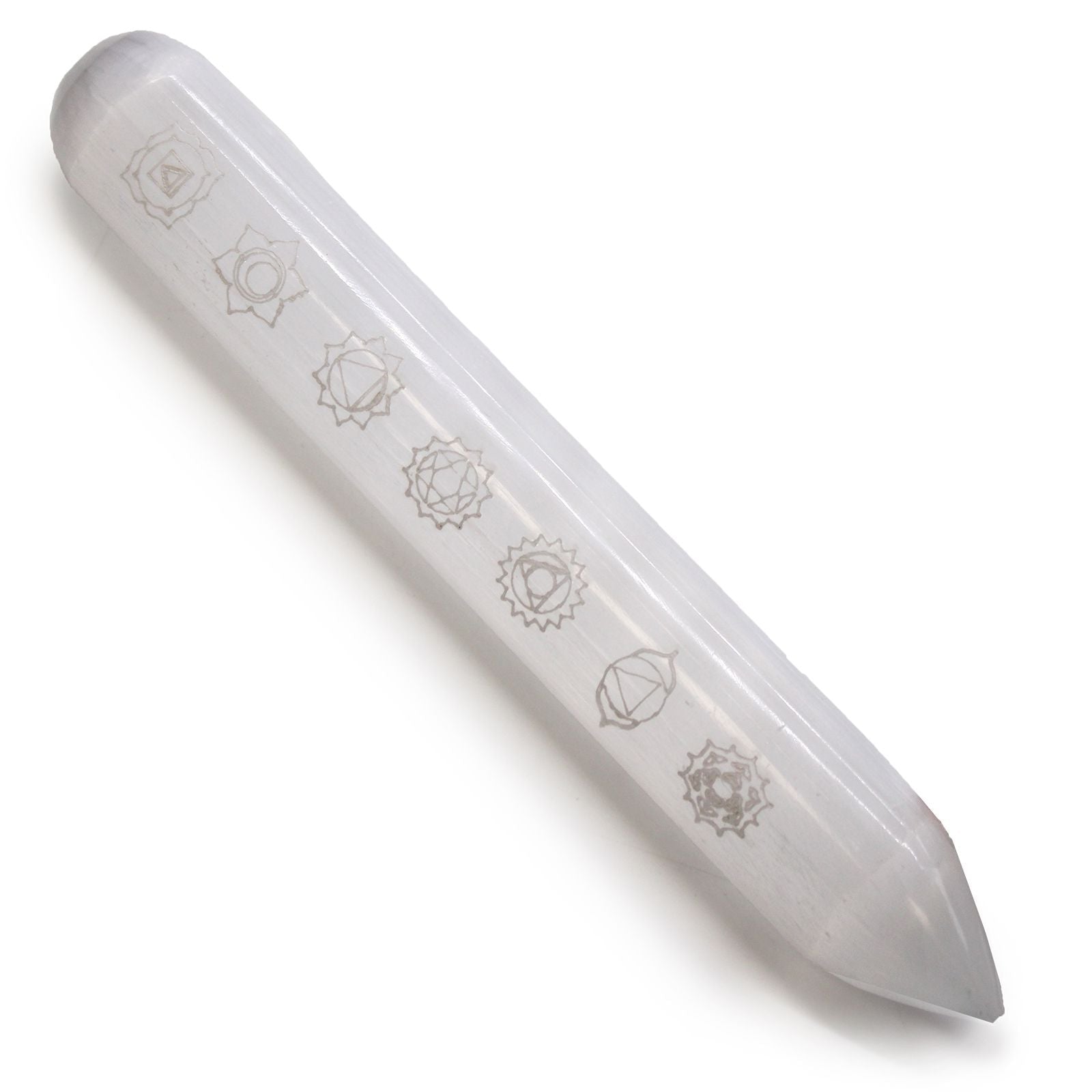 White crystal wand with engraved symbols on a white background