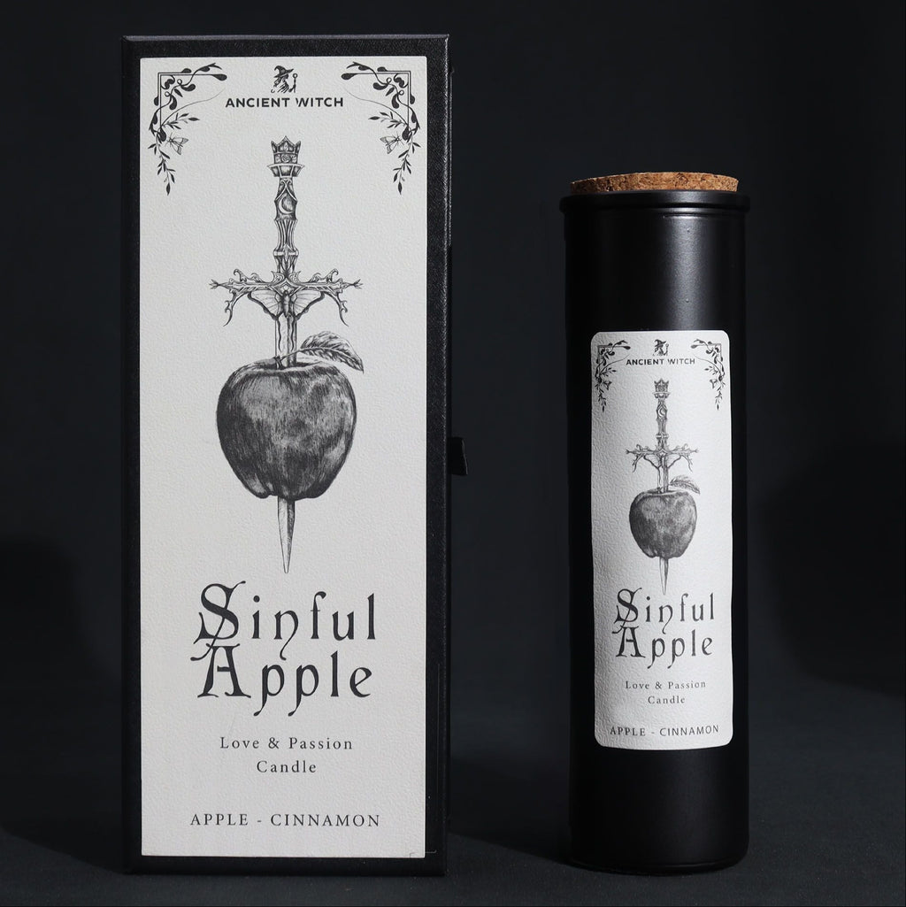 Candle packaging for 'Sinful Apple' with black and white design on a dark background
