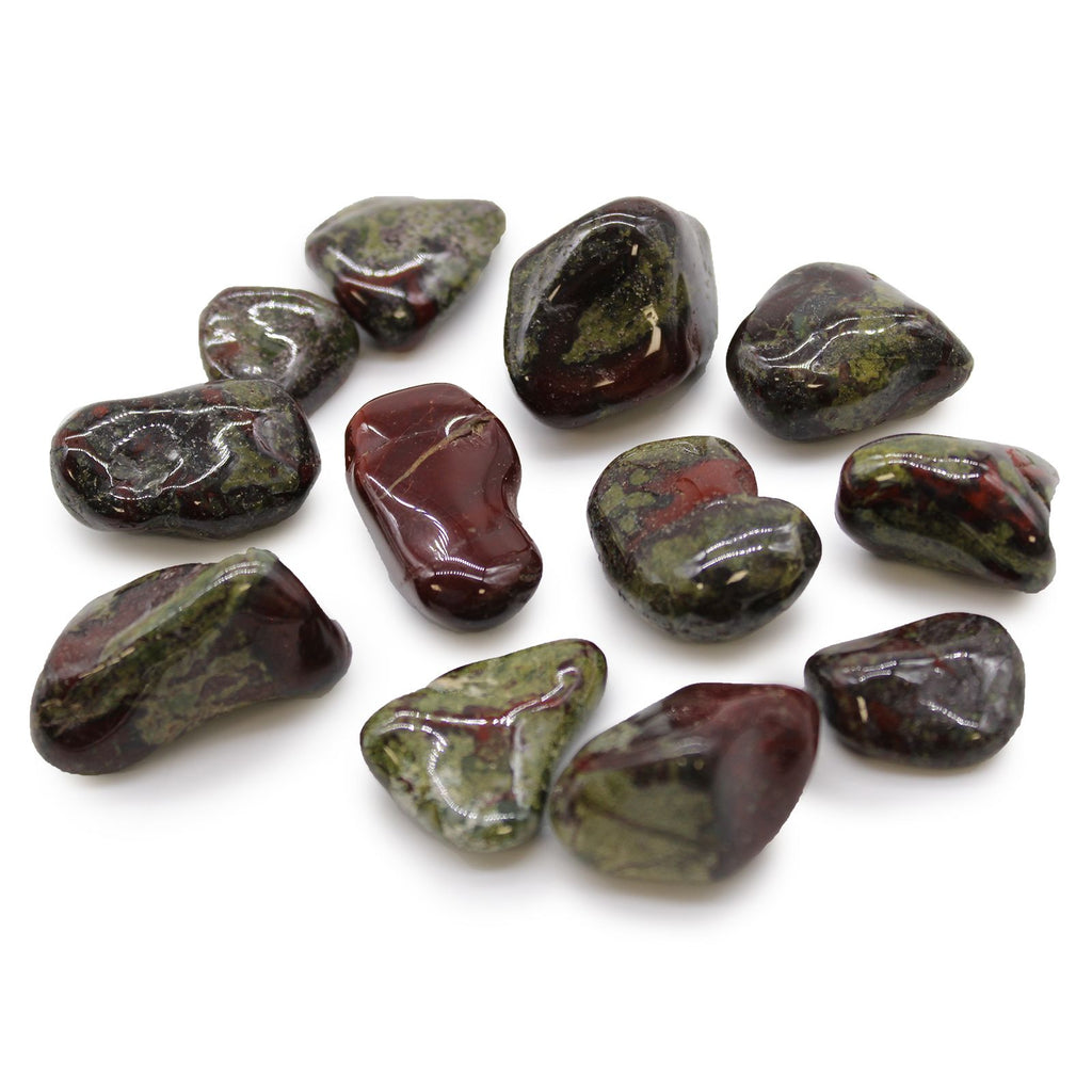Collection of polished gemstones on a white background