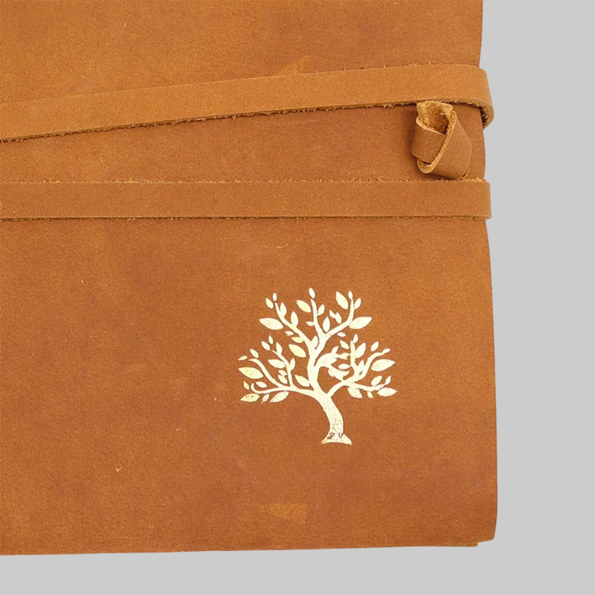 Brown fabric with a white tree design on a white background