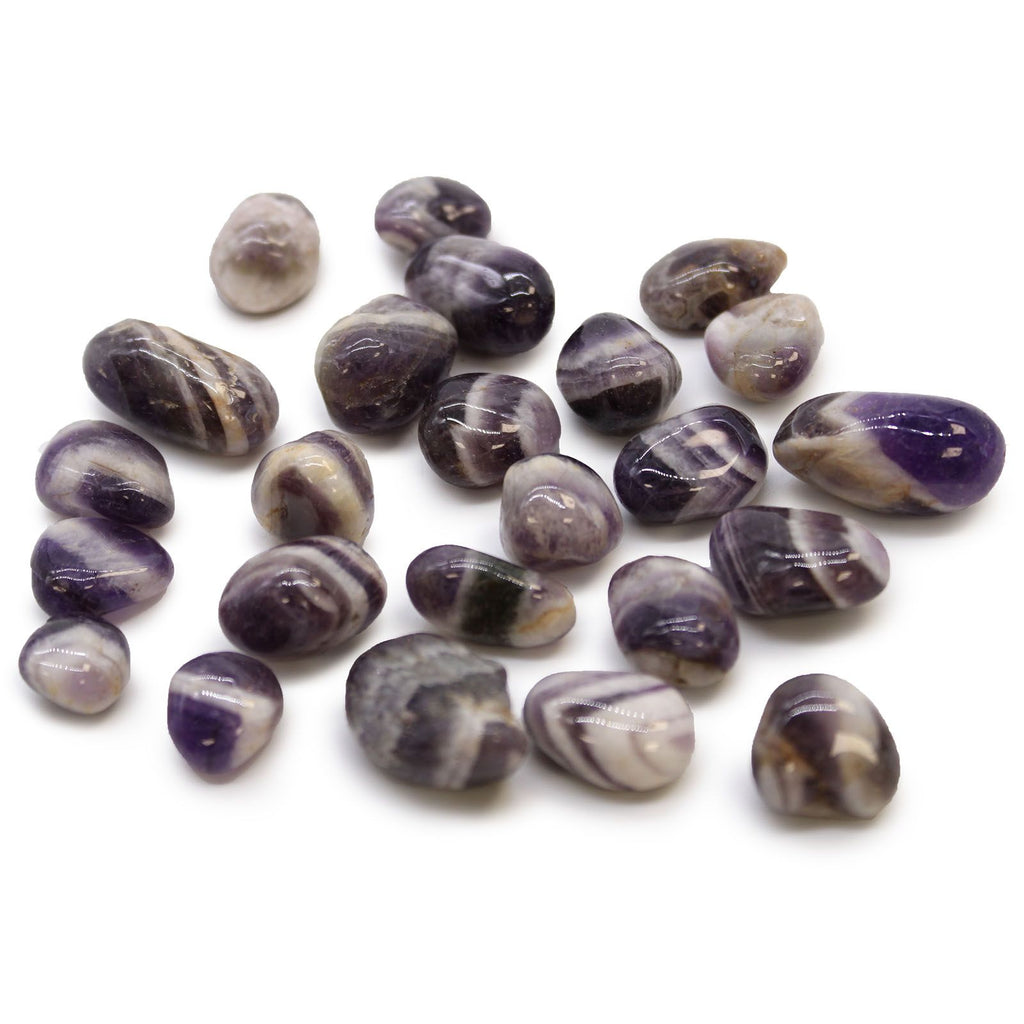 Purple and white striped stones on a white background
