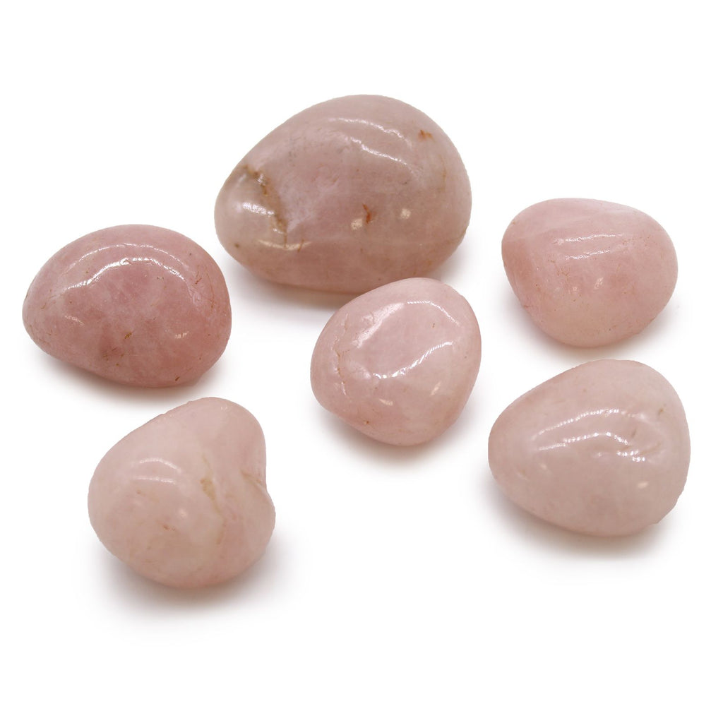 Six pink stones on a white background