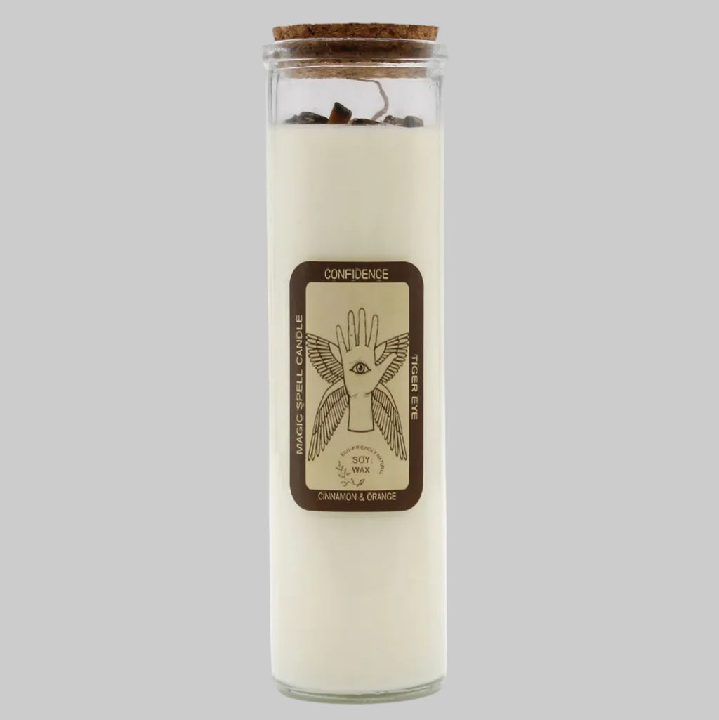 Glass candle with cork lid and label on a white background