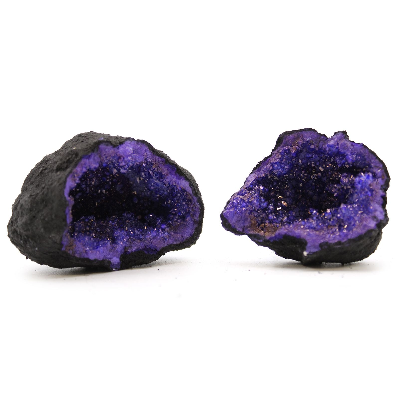 Two purple geode crystals on a white background