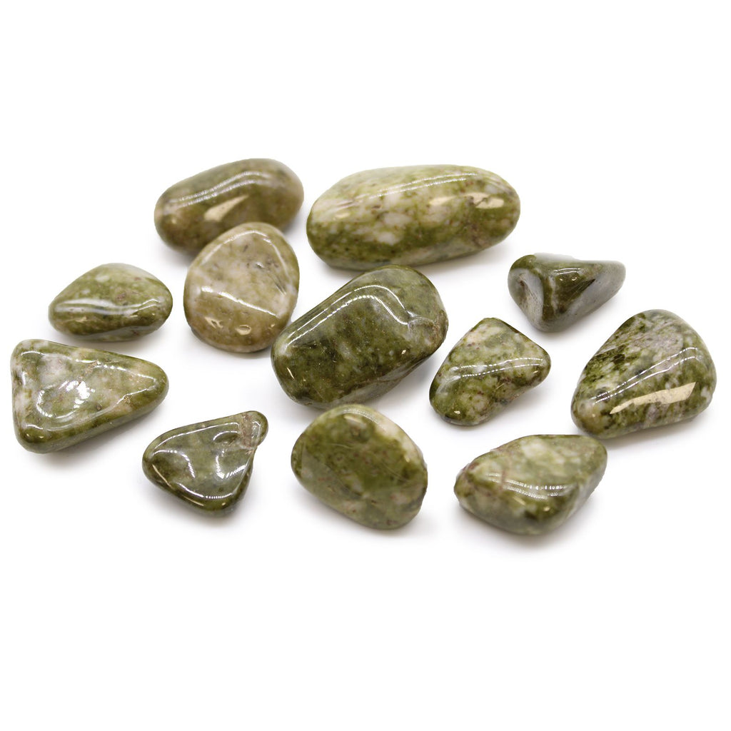 Collection of green stones on a white background