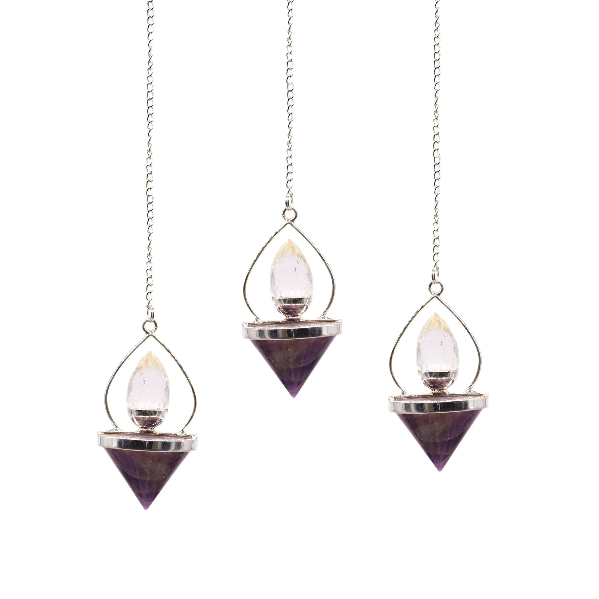 Three hanging crystal pendulums on a white background