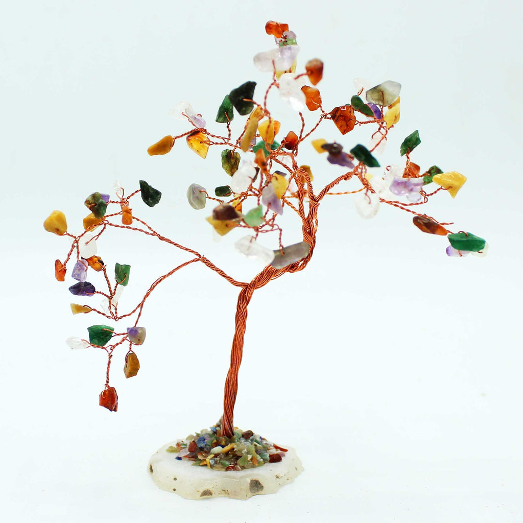 Decorative tree with multicolored stones on a white background