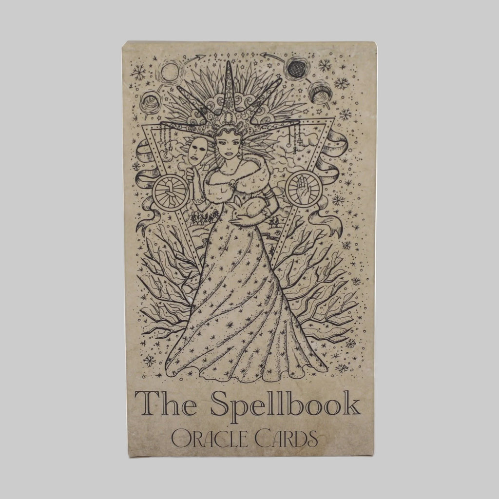 Cardboard box with 'The Spellbook Oracle Cards' design on a white background