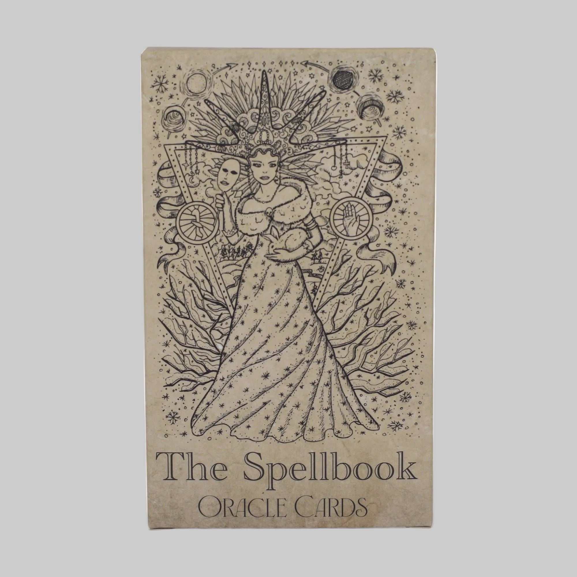 Cardboard box with 'The Spellbook Oracle Cards' design on a white background