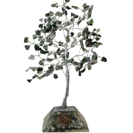 Decorative tree sculpture with green leaves on a white background