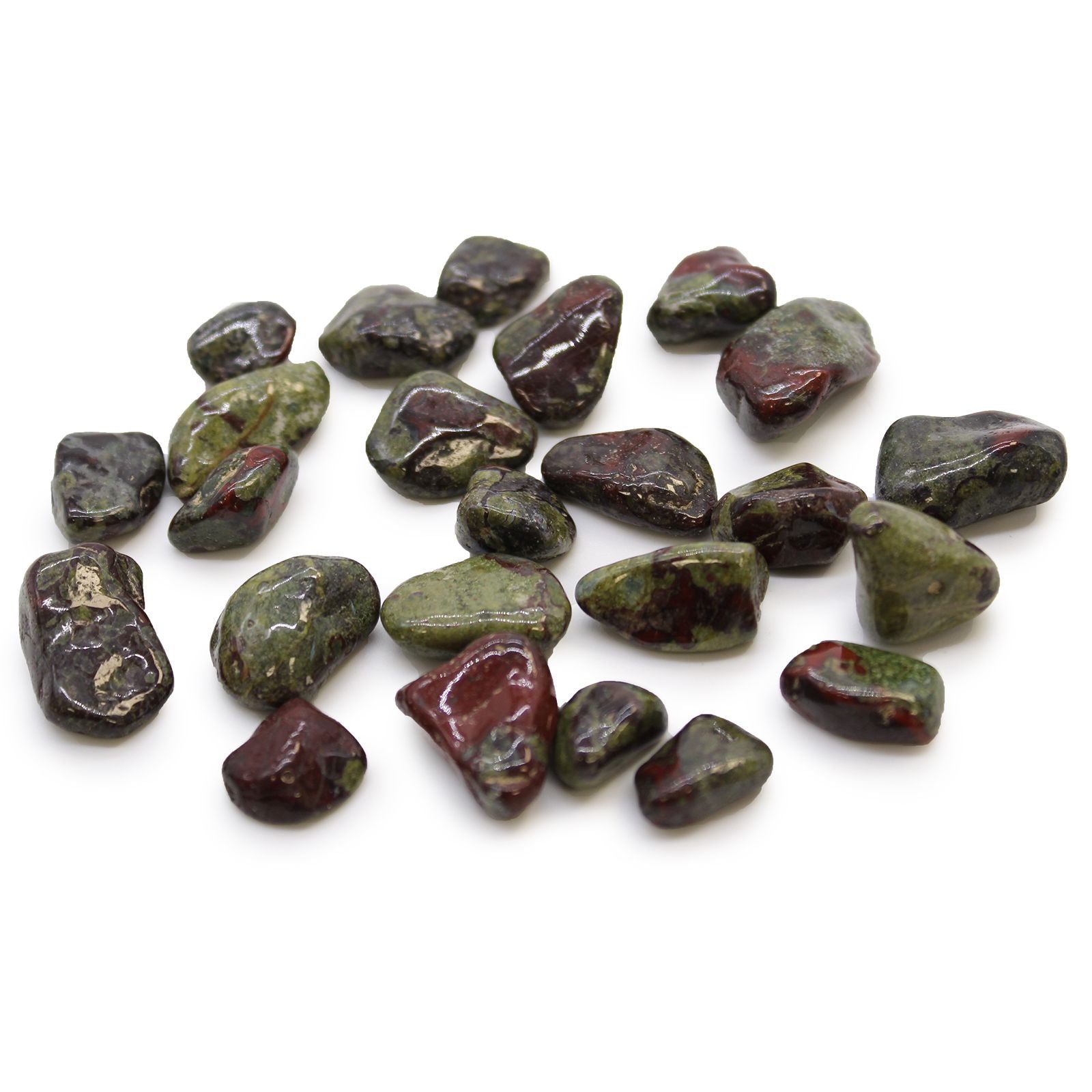 Collection of green and red stones on a white background