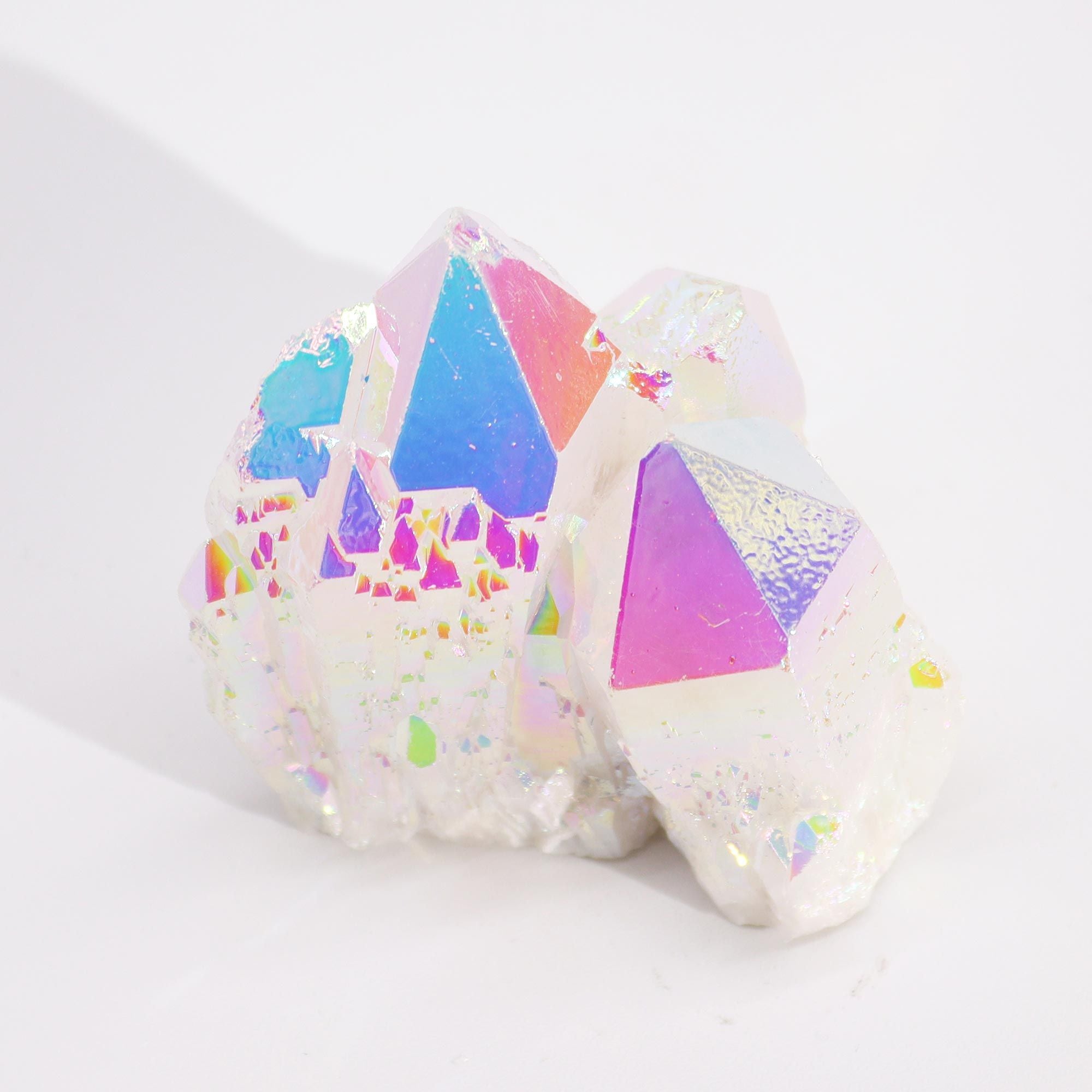 Colorful geometric-patterned bath bombs on a white background