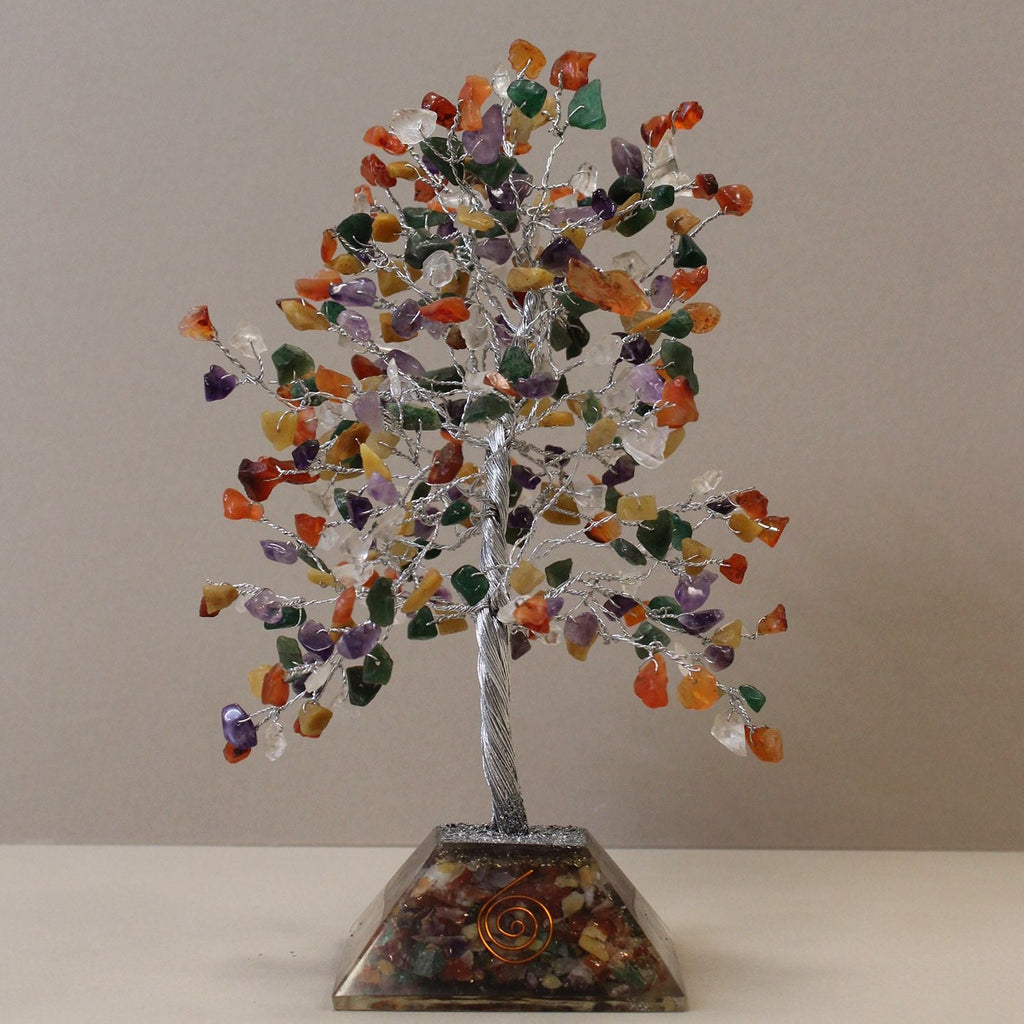 Decorative tree with multicolored stones on a gray background